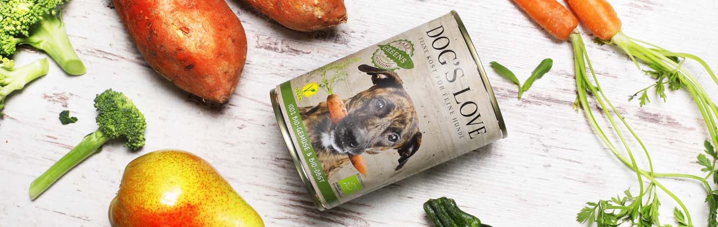 Vegetables on a wooden floor with a DOG'S LOVE can of Green