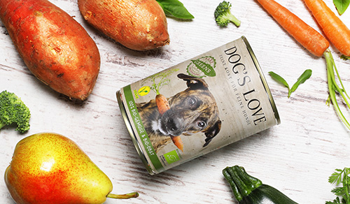 Vegetables on a wooden floor with a DOG'S LOVE can of Green